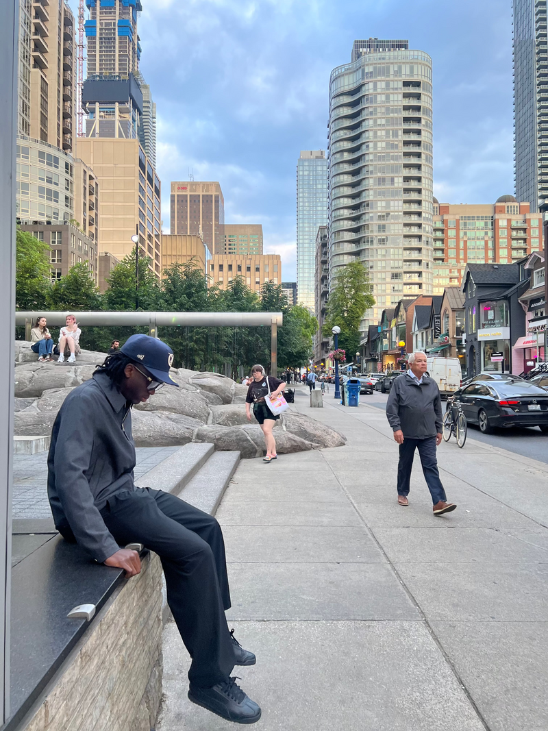 Ashraf Bonseu Wearing SQRL Prestige Glasses in Yorkville Toronto