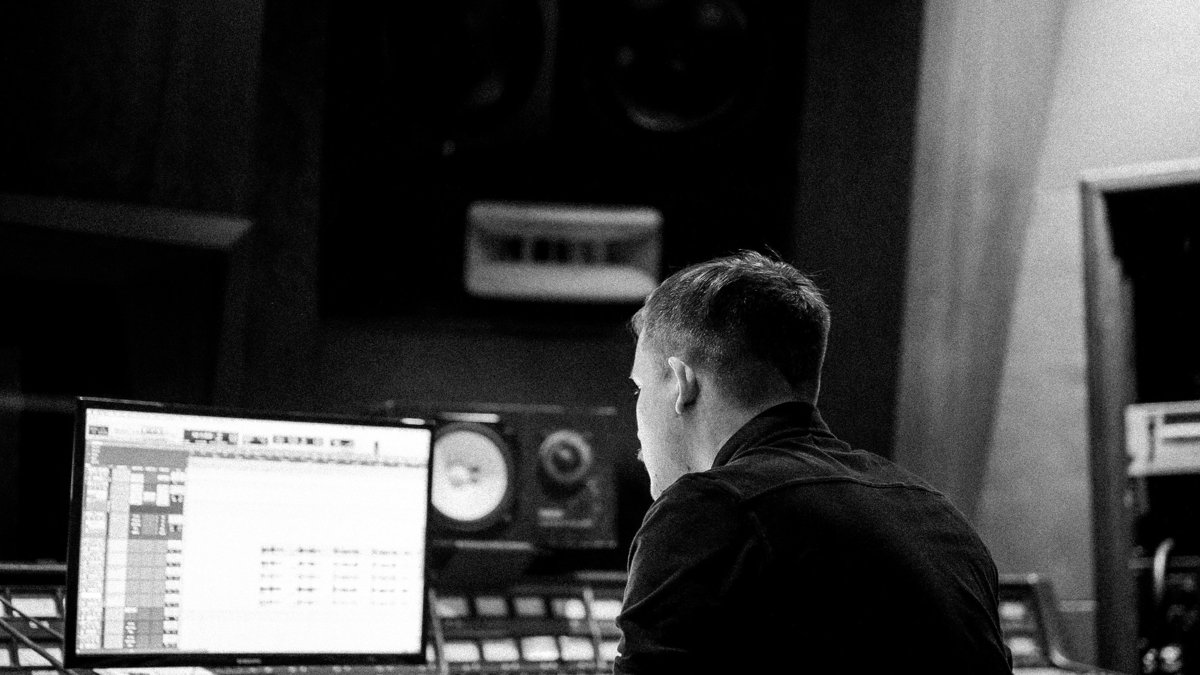 Man staring at screen in the dark